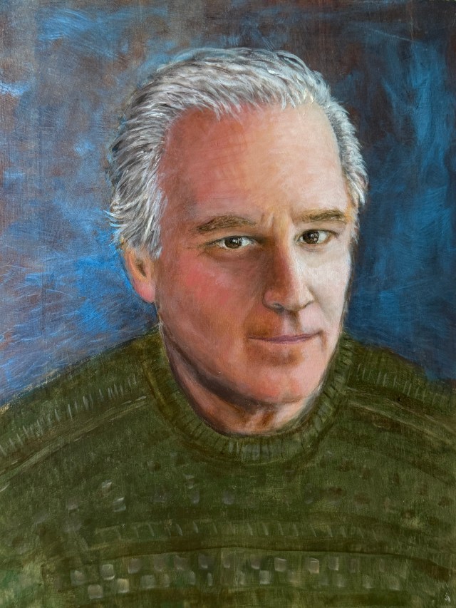 Portrait of Dave Frank Henderson, green sweater, blue soft background